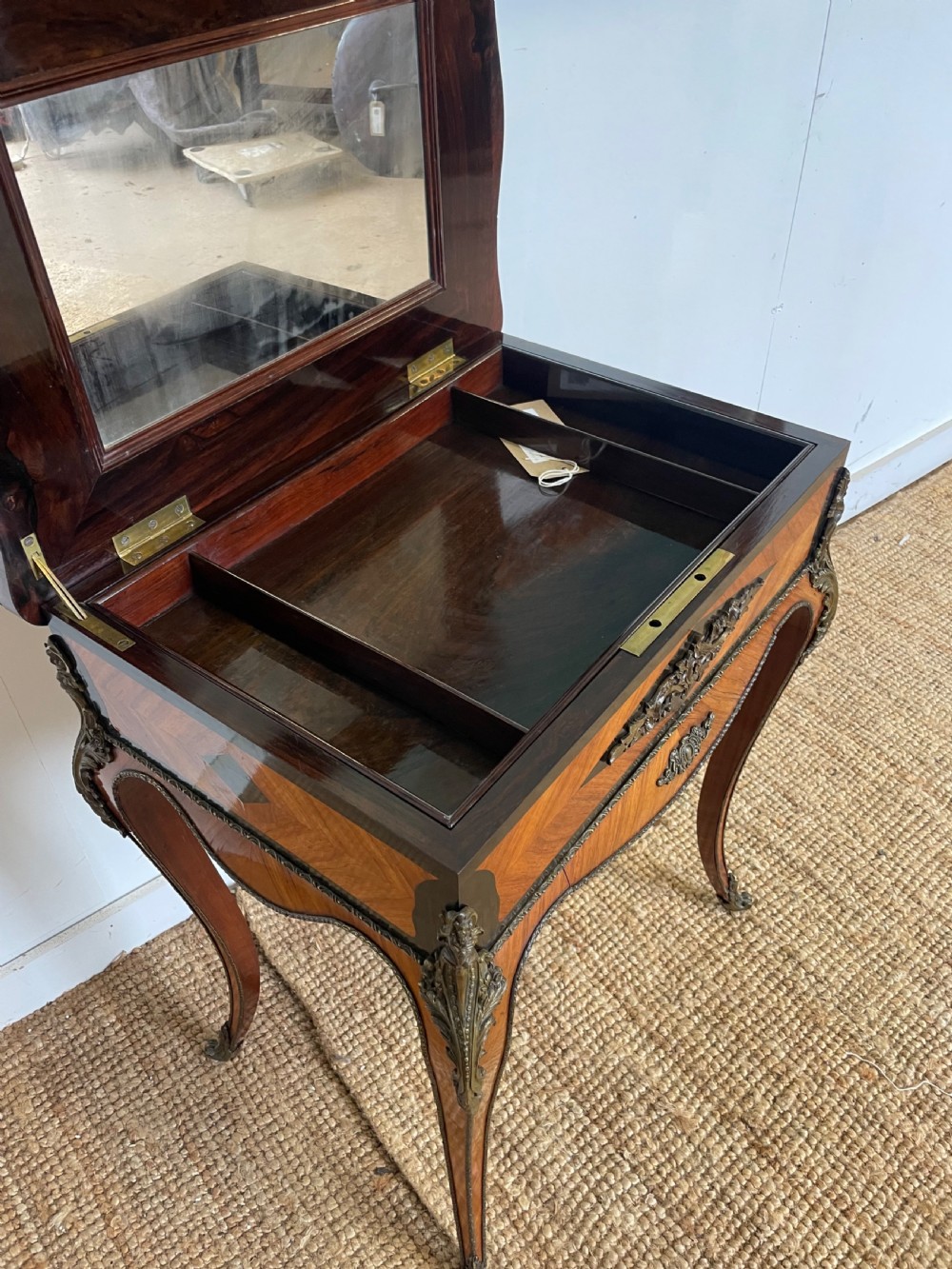 A 19th-century French Napoleon III kingwood worktable featuring parquetry top surface, serpentine cabriole legs, and cast brass mounts. View VII