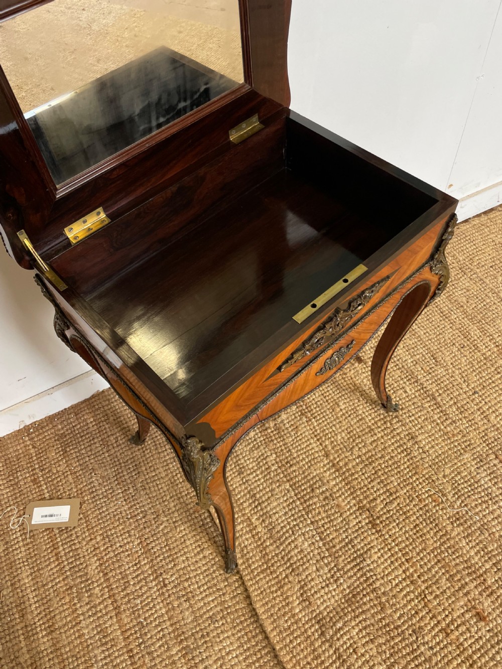 A 19th-century French Napoleon III kingwood worktable featuring parquetry top surface, serpentine cabriole legs, and cast brass mounts. View VIII