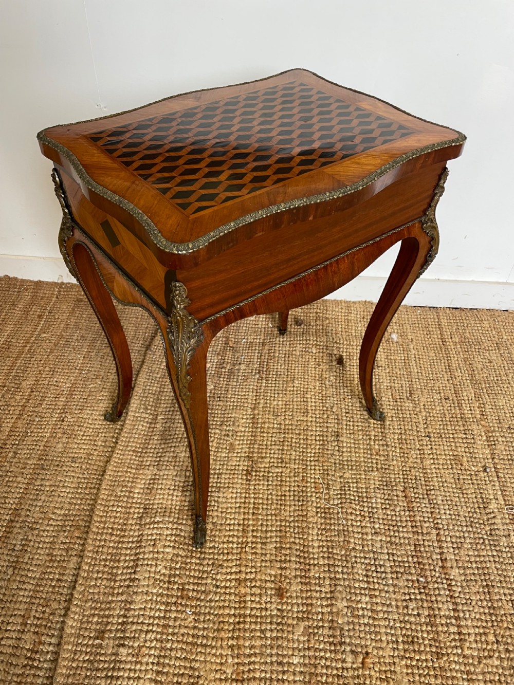 A 19th-century French Napoleon III kingwood worktable featuring parquetry top surface, serpentine cabriole legs, and cast brass mounts. View XI
