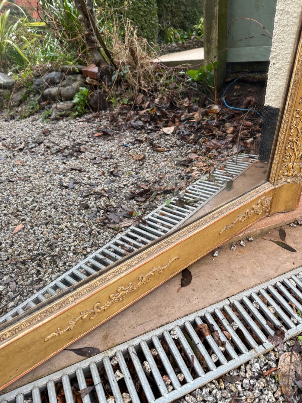 A large rectangular early 19th-century Empire style overmantel mirror featuring a gilded frame with ornate floral moulding. View VIII