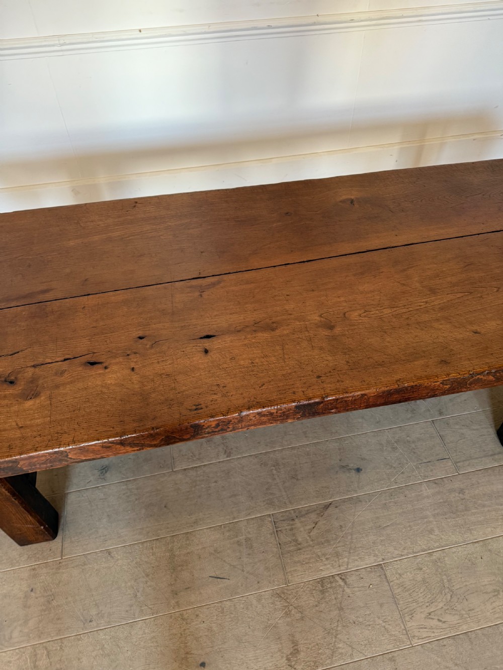 A large rectangular 19th-century elm coffee table with a two-plank top and sturdy wooden legs. View III