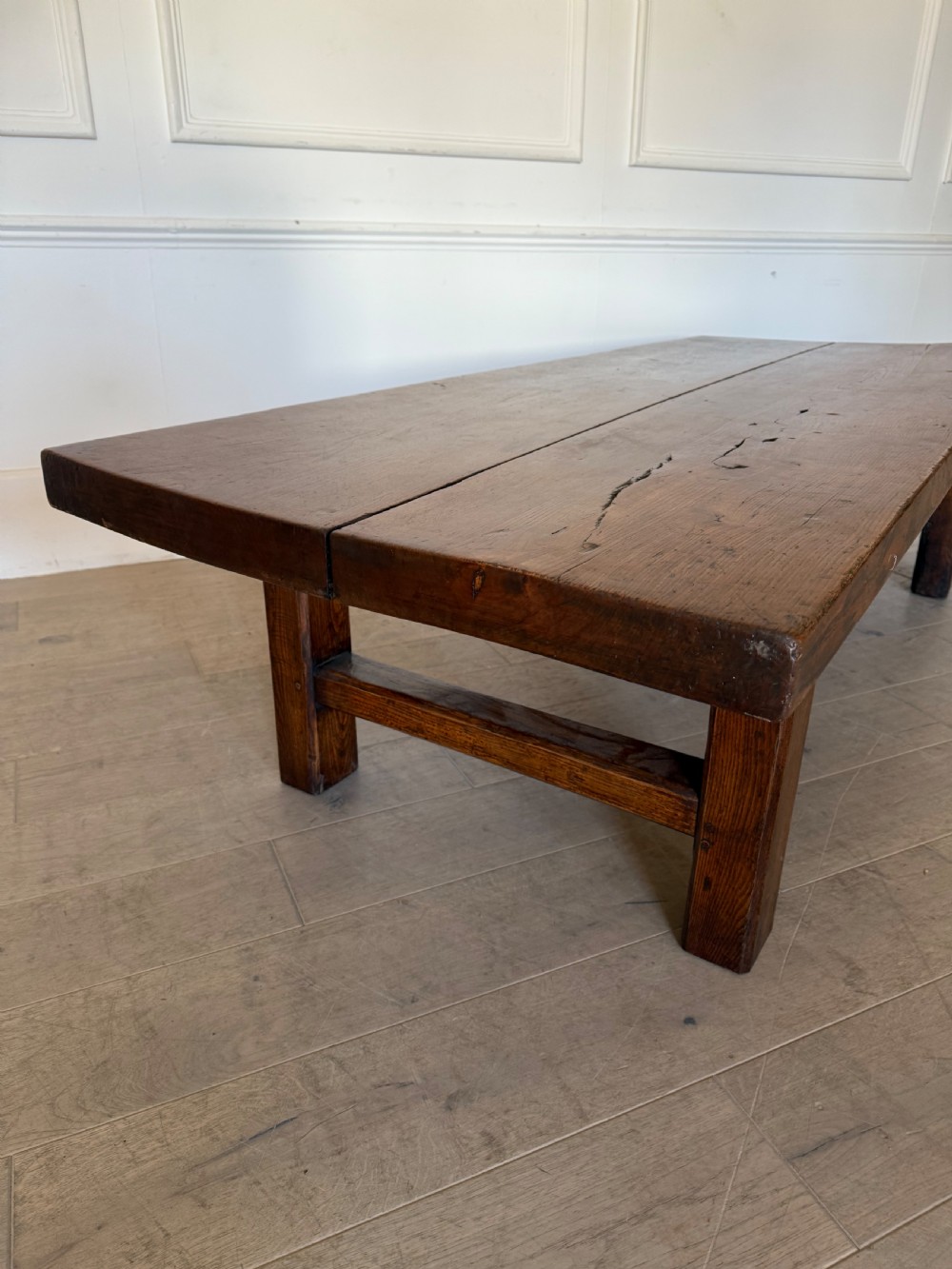 A large rectangular 19th-century elm coffee table with a two-plank top and sturdy wooden legs. View VIII