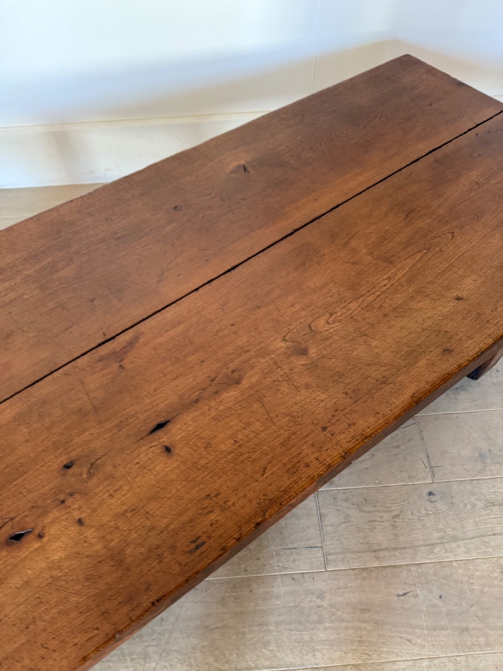 A large rectangular 19th-century elm coffee table with a two-plank top and sturdy wooden legs. View XI