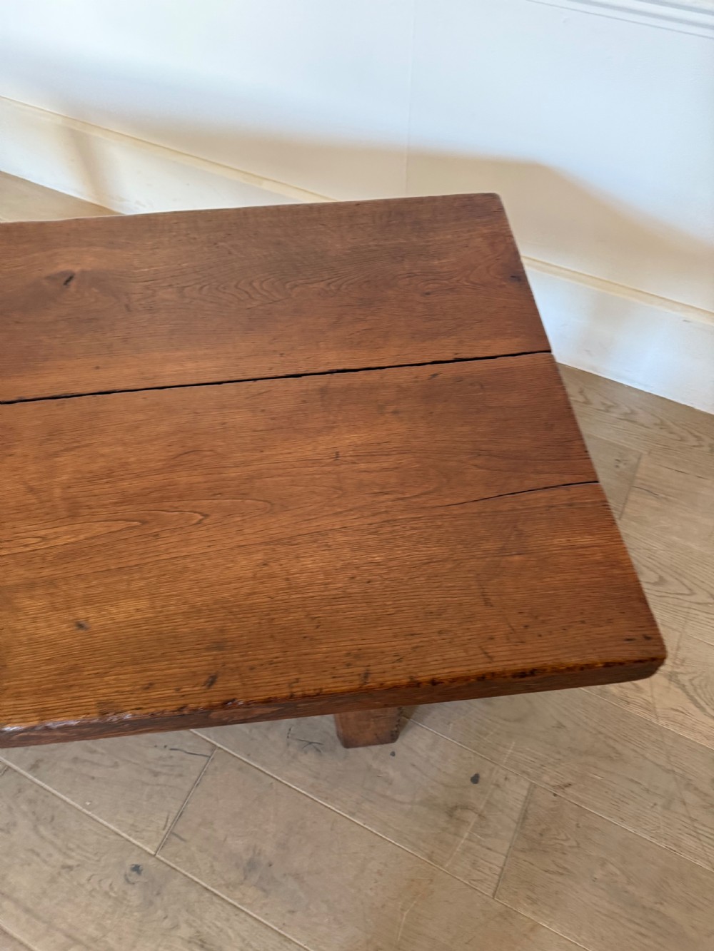 A large rectangular 19th-century elm coffee table with a two-plank top and sturdy wooden legs. View XII