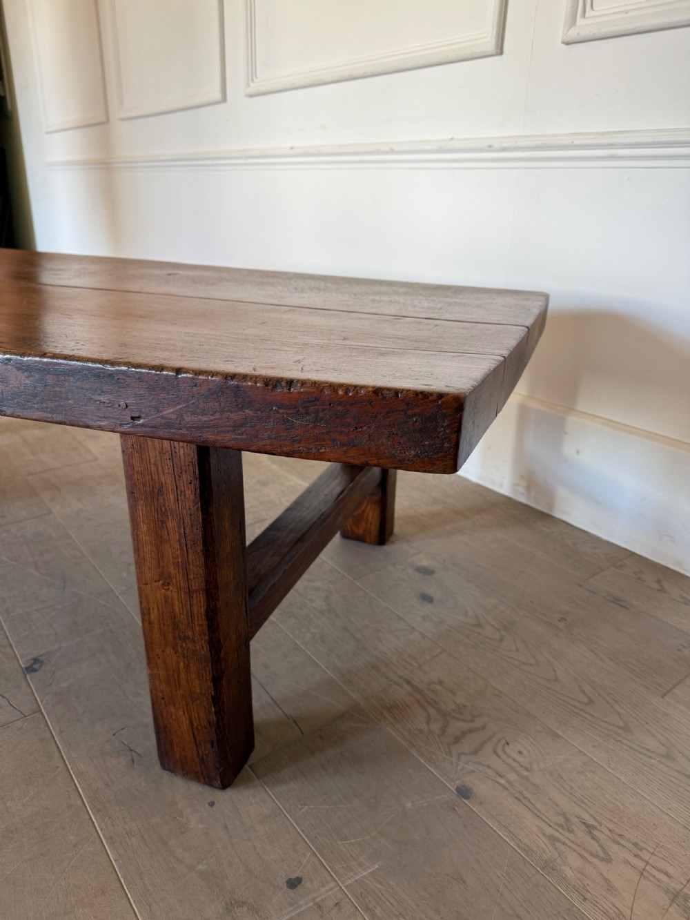 A large rectangular 19th-century elm coffee table with a two-plank top and sturdy wooden legs. View XIII
