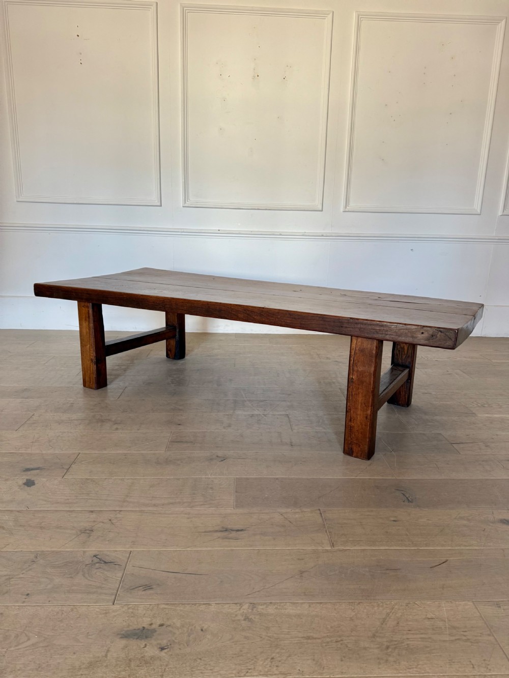A large rectangular 19th-century elm coffee table with a two-plank top and sturdy wooden legs. View XIV