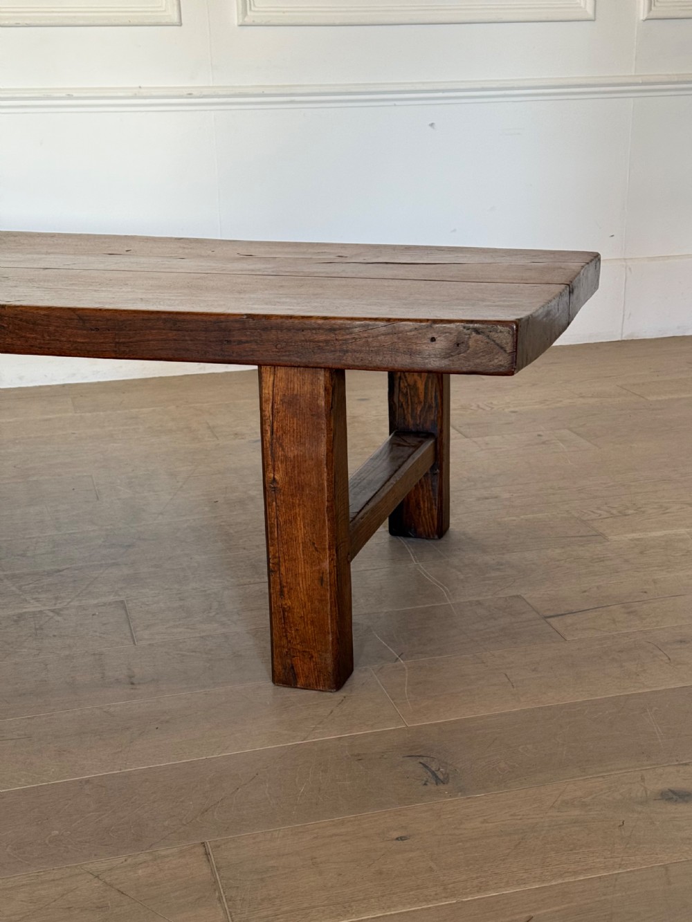 A large rectangular 19th-century elm coffee table with a two-plank top and sturdy wooden legs. View XV