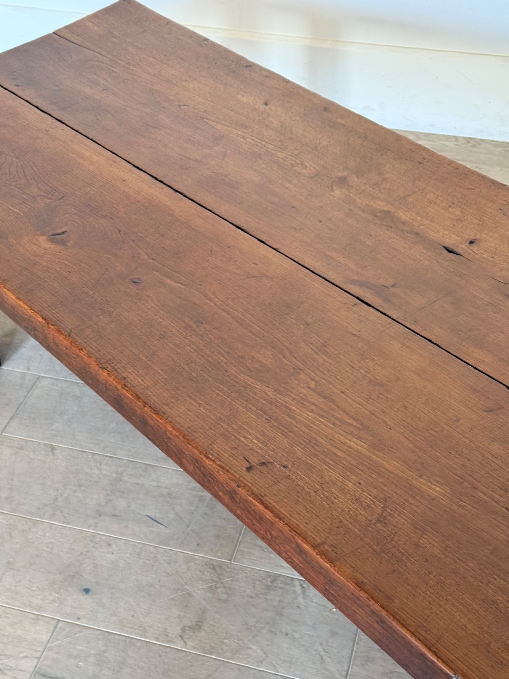 A large rectangular 19th-century elm coffee table with a two-plank top and sturdy wooden legs. View XVII
