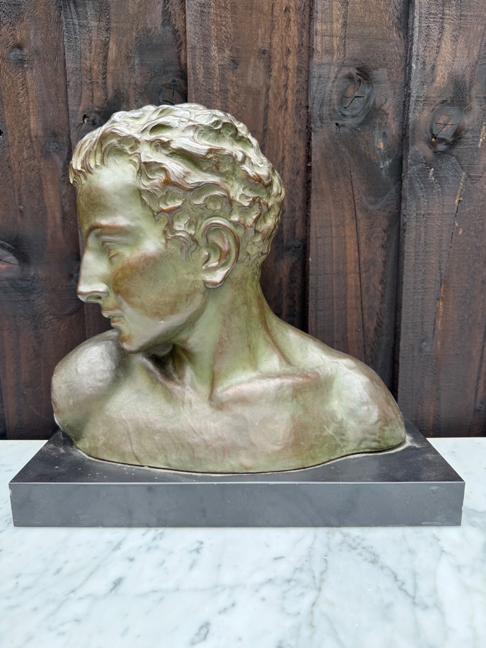 Art deco terracotta bust of a boy , J Dommisse 