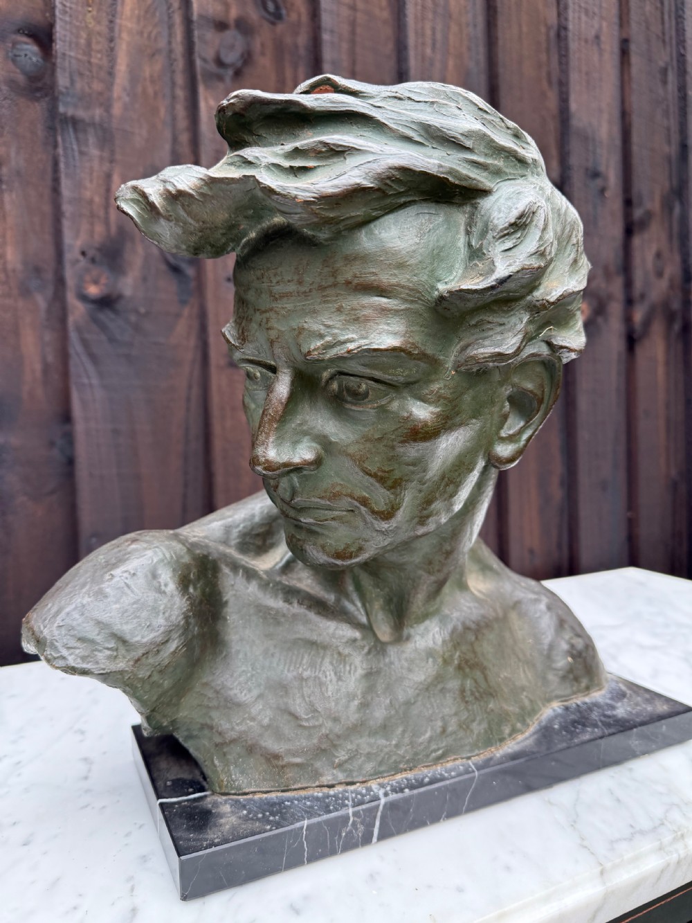 Art deco terracotta bust of a man , J Dommisse 