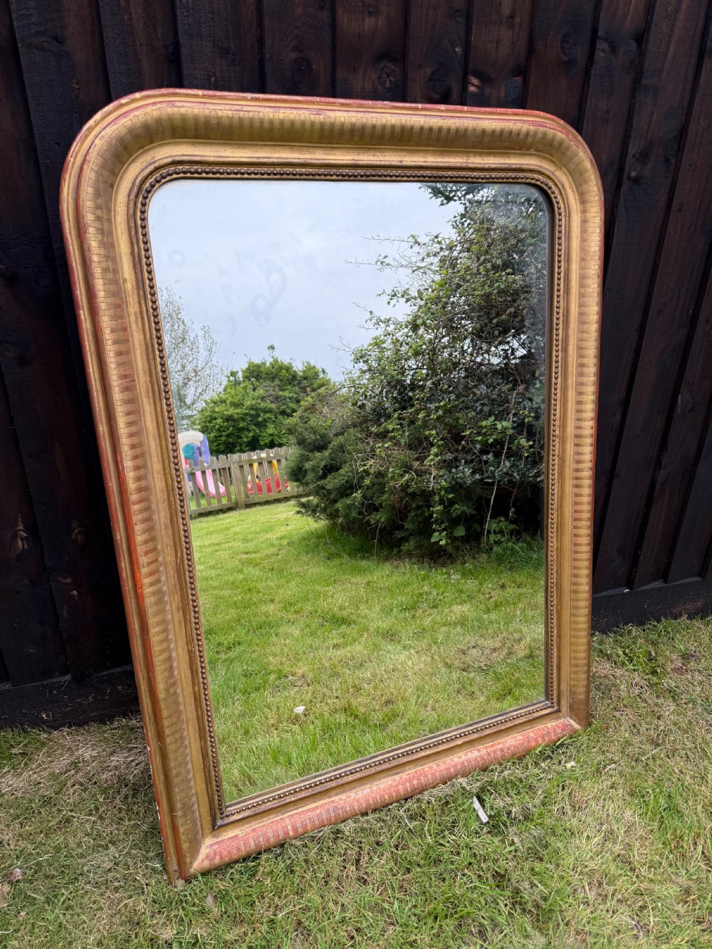 19th century arched topped gilt mirror 