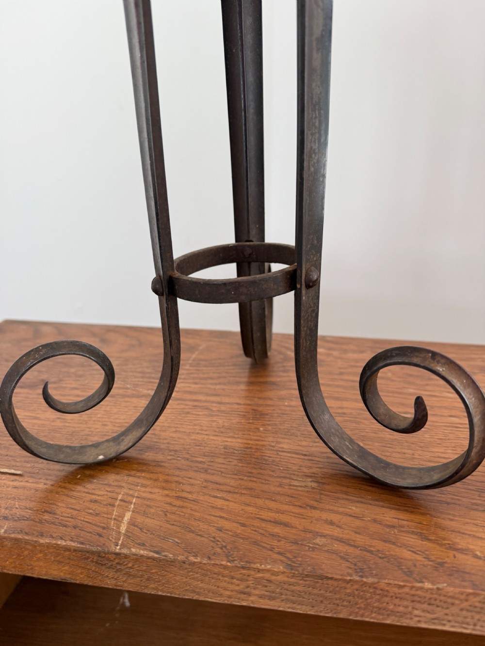 A pair of dark patinated metal three-light candelabras constructed from re-purposed military bayonet parts and scrollwork legs. View IV
