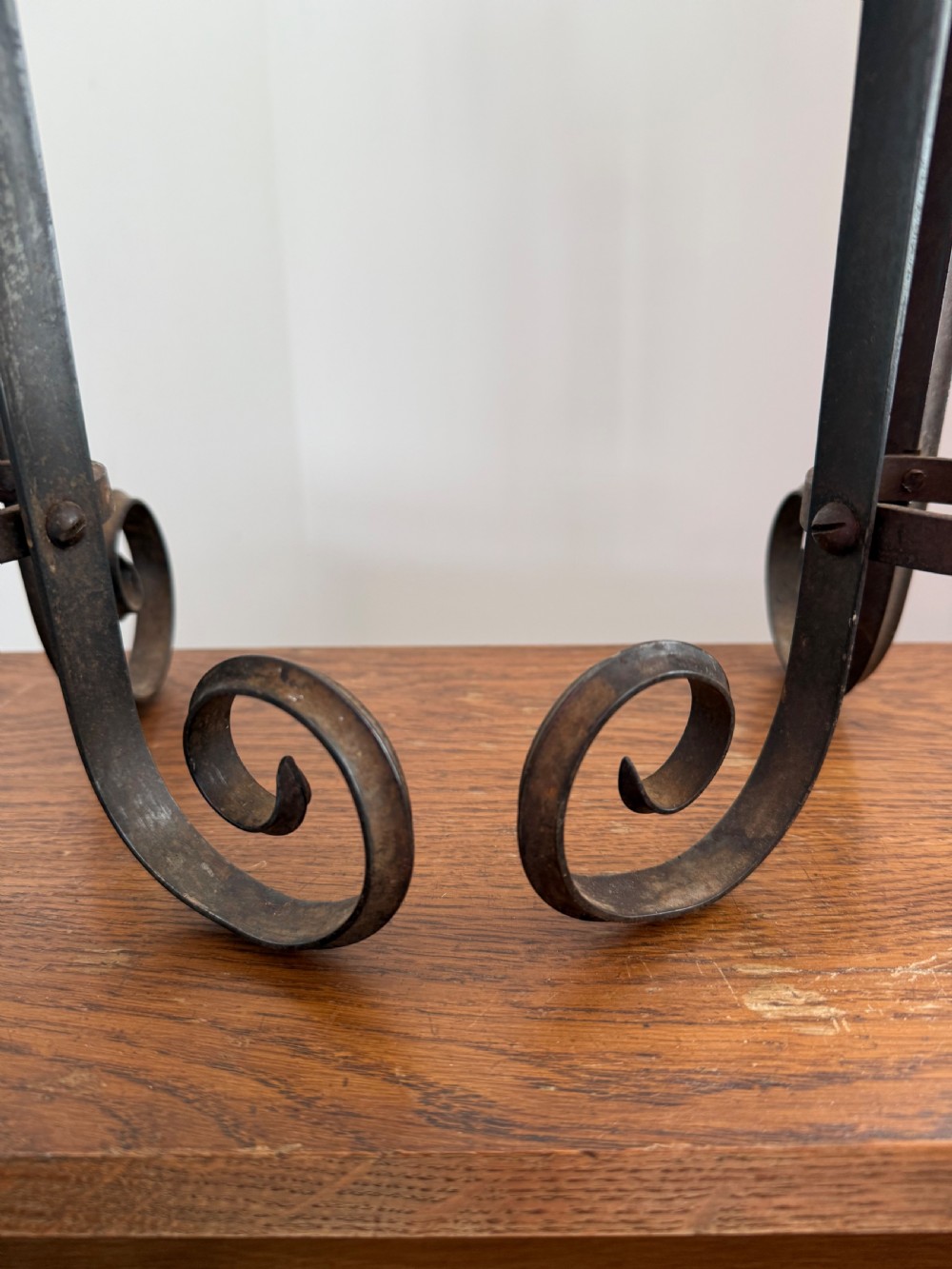 A pair of dark patinated metal three-light candelabras constructed from re-purposed military bayonet parts and scrollwork legs. View VI