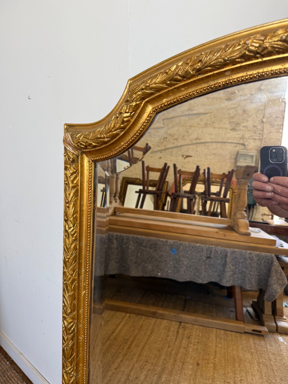A late 19th-century tall arched-top wall mirror featuring a gilded wood frame with leaf moulding. View III
