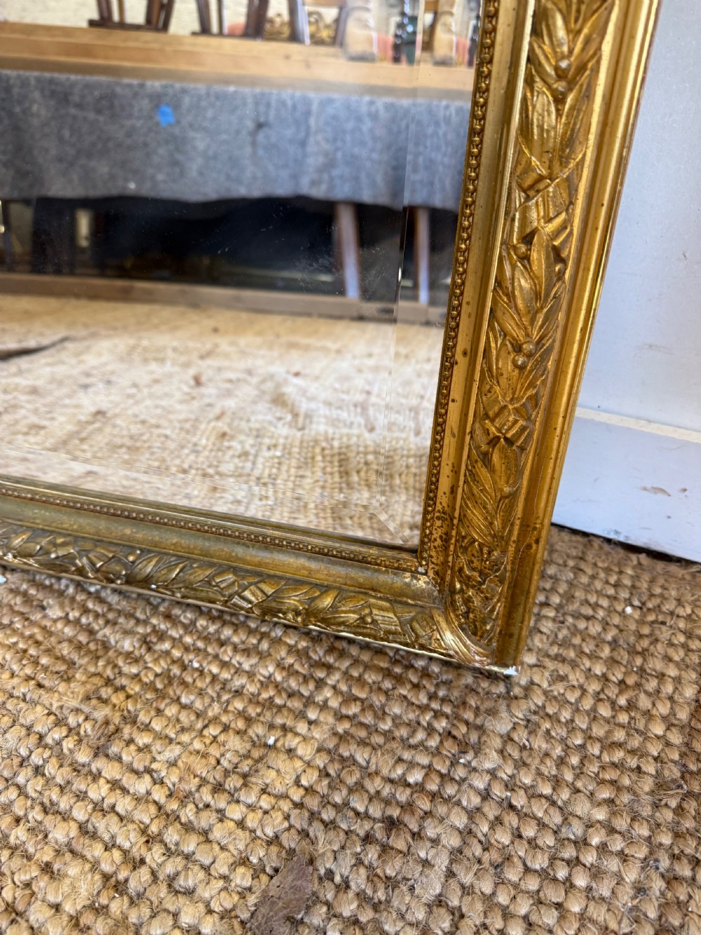 A late 19th-century tall arched-top wall mirror featuring a gilded wood frame with leaf moulding. View VI