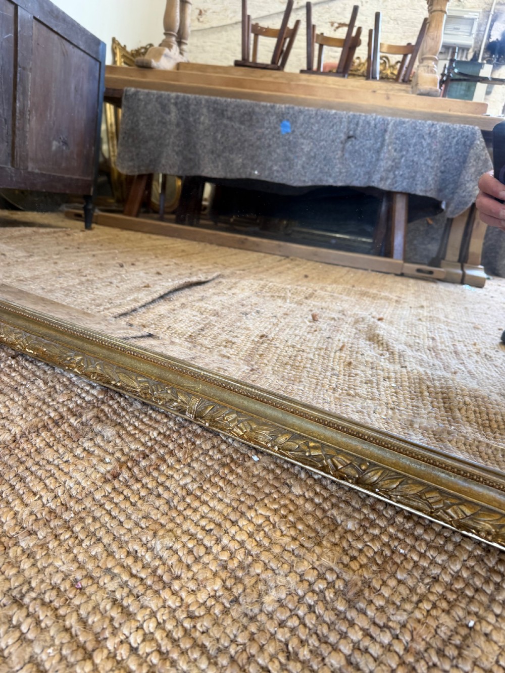 A late 19th-century tall arched-top wall mirror featuring a gilded wood frame with leaf moulding. View VII
