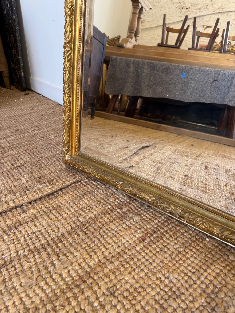 A late 19th-century tall arched-top wall mirror featuring a gilded wood frame with leaf moulding. View VIII