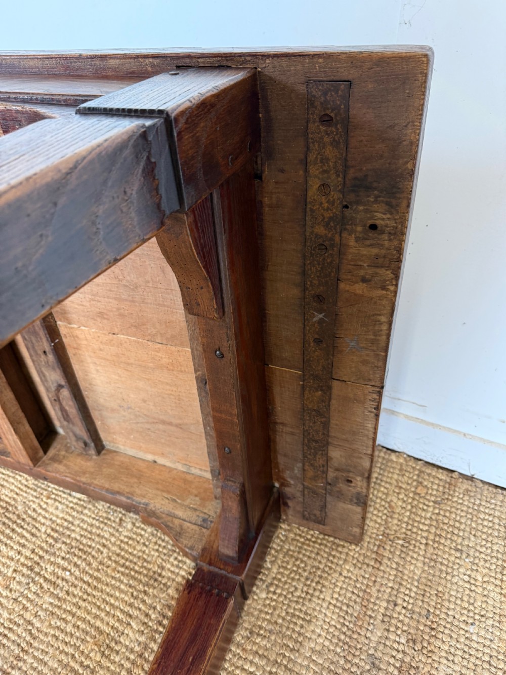 A low rectangular 19th-century dark elm coffee table featuring a wide plank top, central apron drawer with a round wooden knob, and four square legs. View XIV