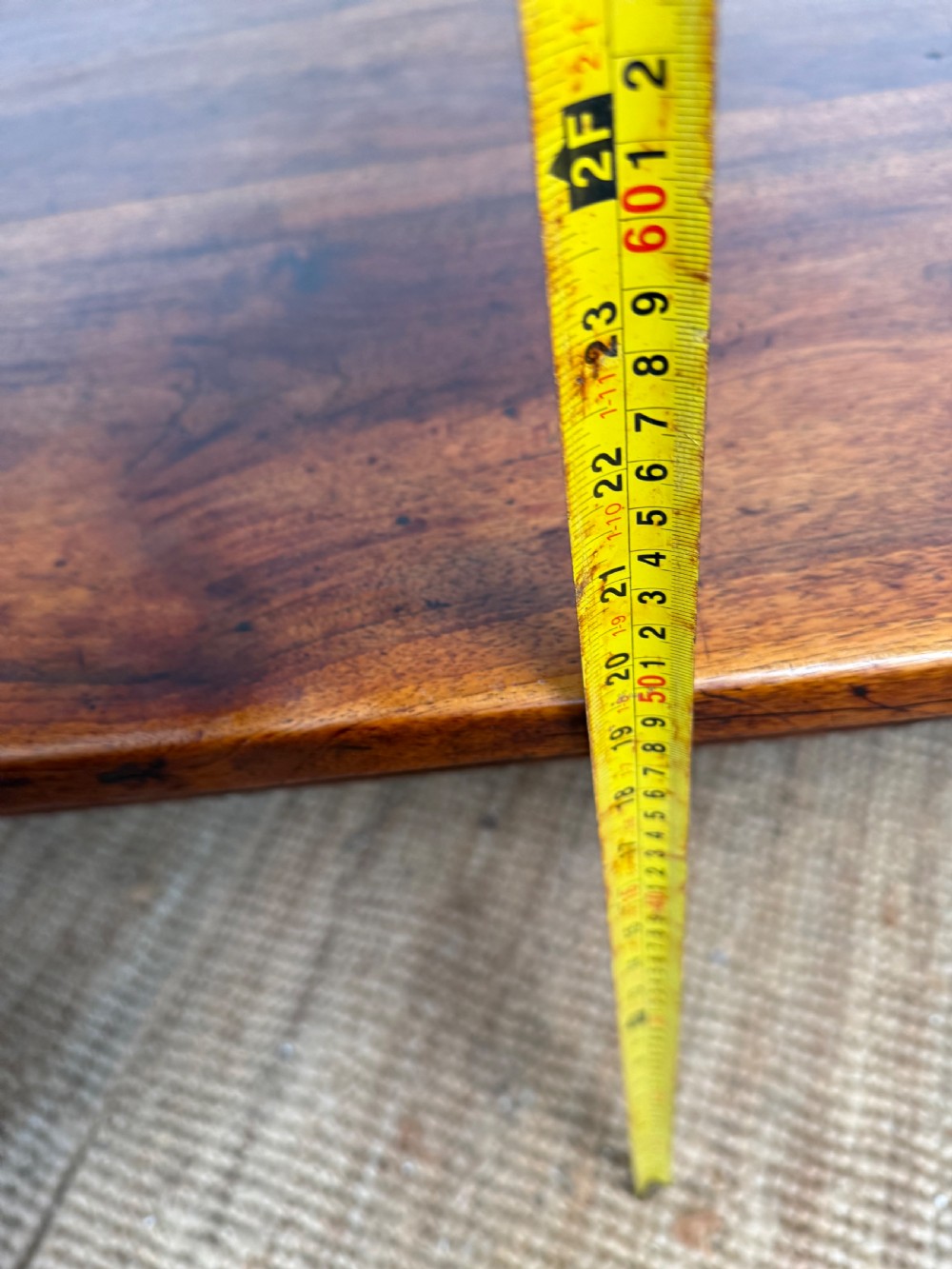 A large rectangular coffee table crafted from dark walnut wood featuring a plank top surface and four straight tapered legs. View XIV