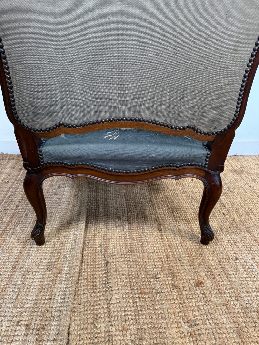 A late 19th-century open armchair with a carved walnut frame, cabriole legs, and muted green tapestry upholstery featuring pictorial motifs. View XI
