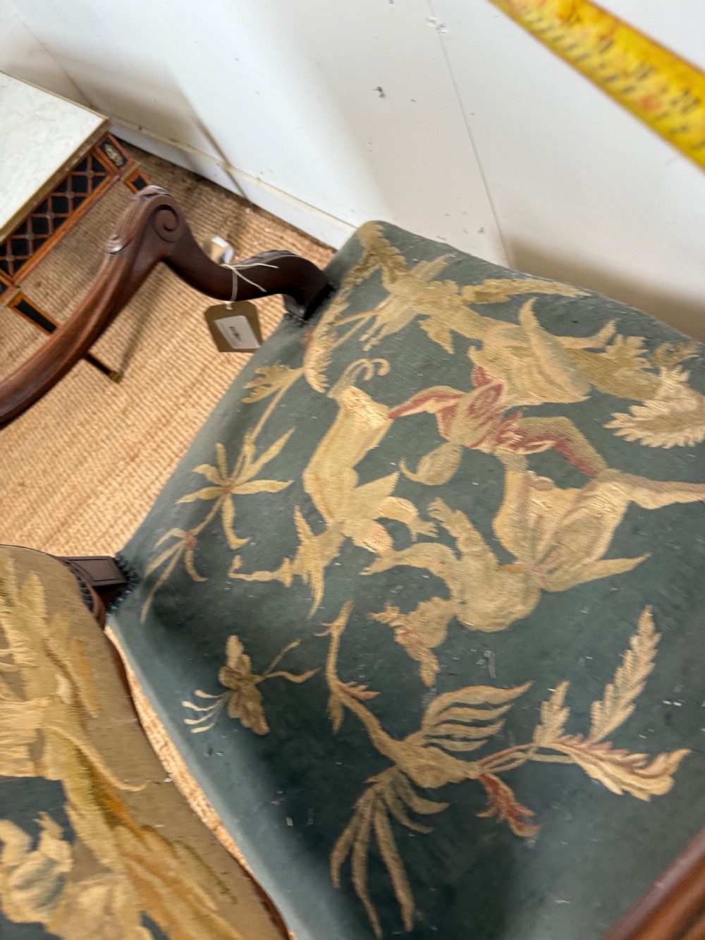 A late 19th-century open armchair with a carved walnut frame, cabriole legs, and muted green tapestry upholstery featuring pictorial motifs. View XV