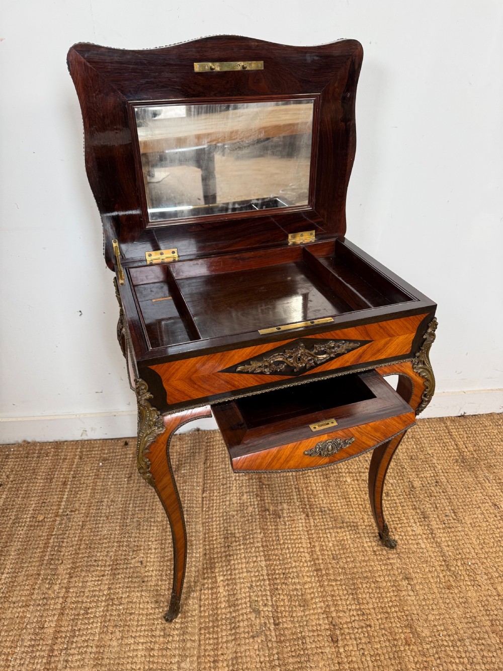 A 19th-century French Napoleon III work table with diamond geometric parquetry, gilt bronze mounts, and cabriole legs. View V