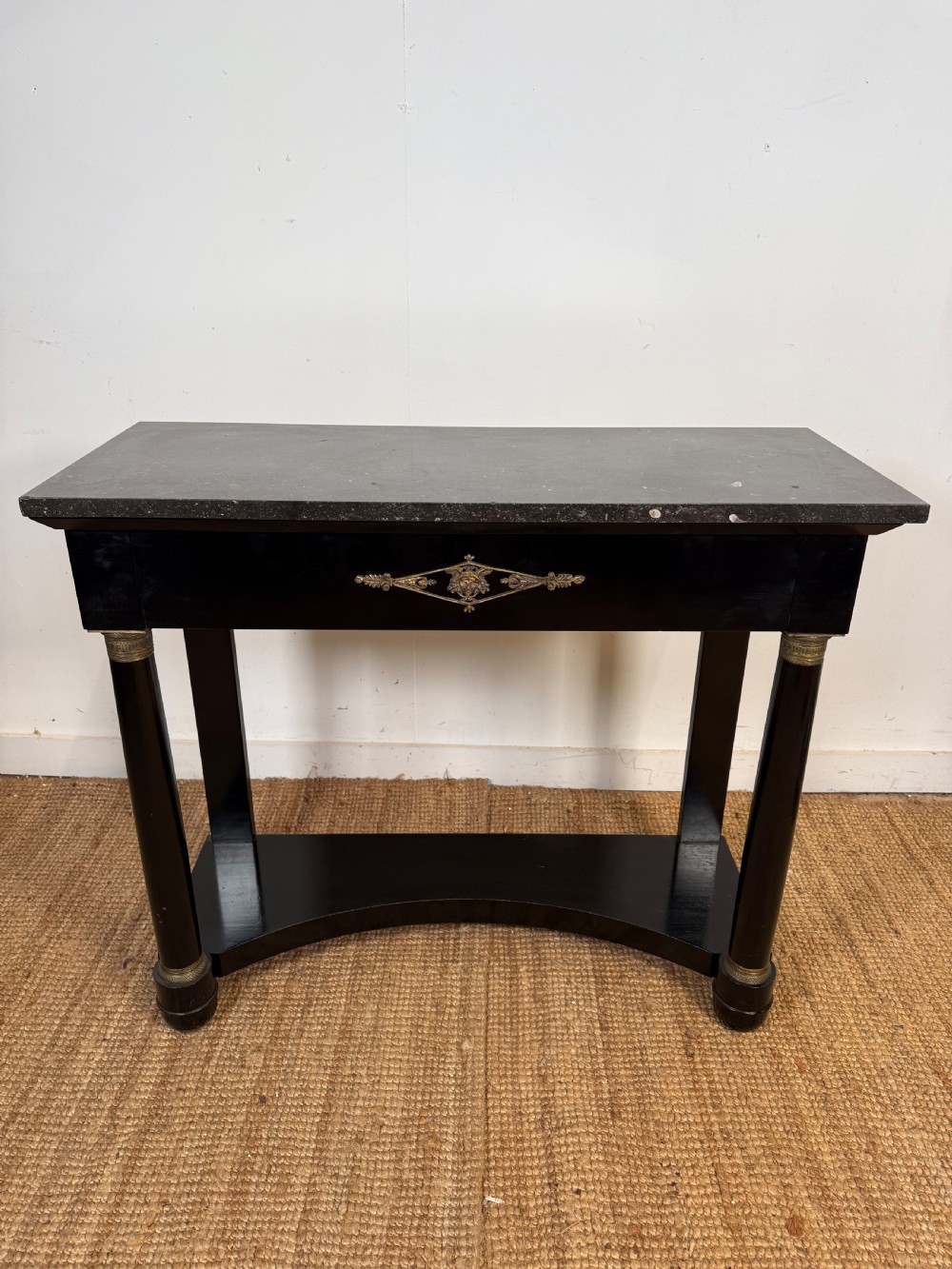 Ebonised console table in the empire style