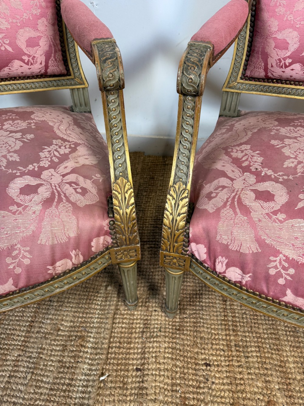 A pair of Louis XVI style French open armchairs featuring carved giltwood frames, fluted legs, and pink damask pattern upholstery. View VII