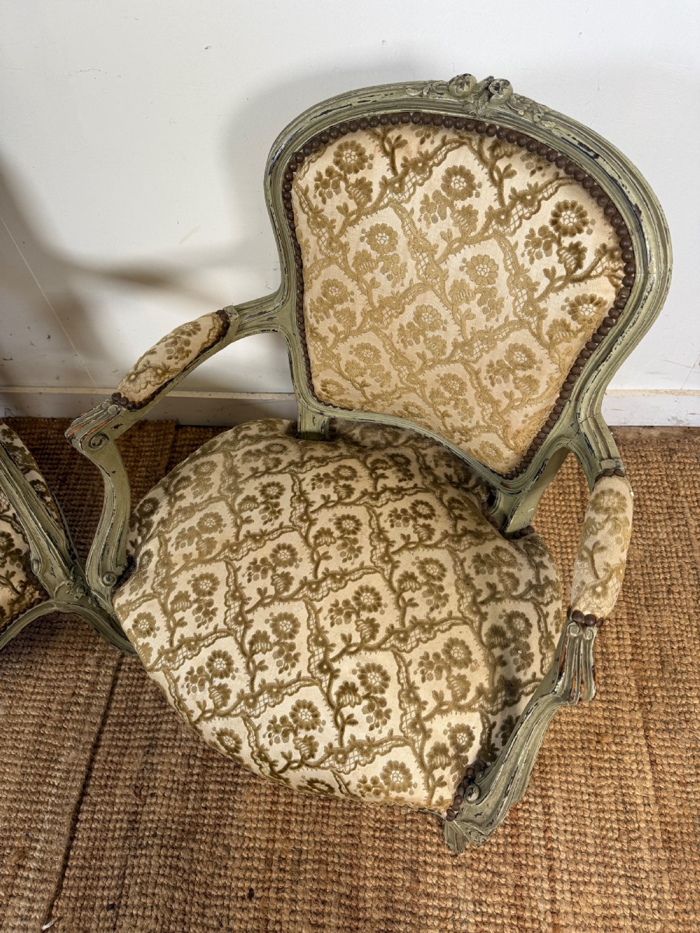A pair of late 19th-century French style open armchairs with carved muted green painted frames and patterned velvet fabric. View VII