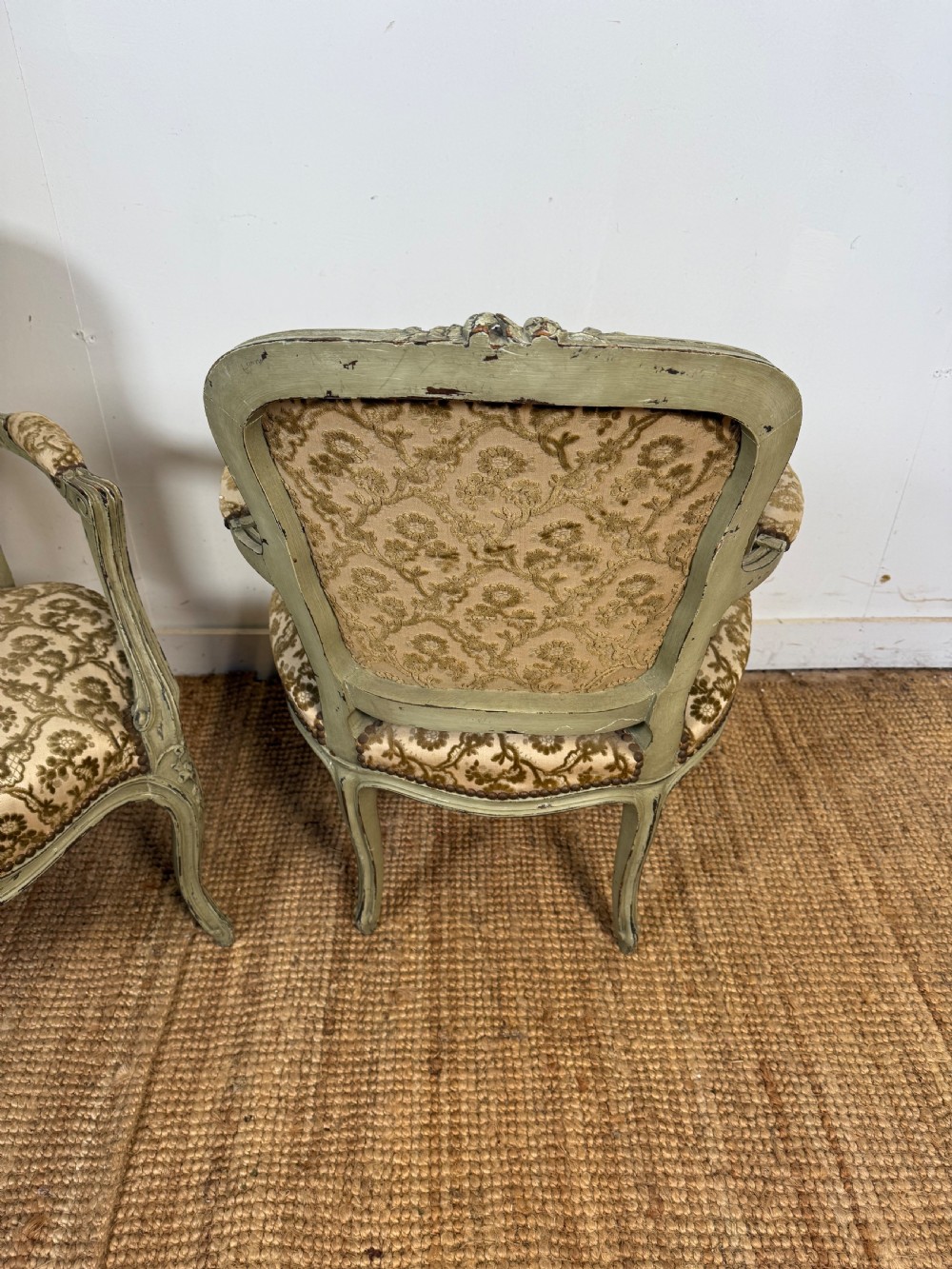 A pair of late 19th-century French style open armchairs with carved muted green painted frames and patterned velvet fabric. View VIII
