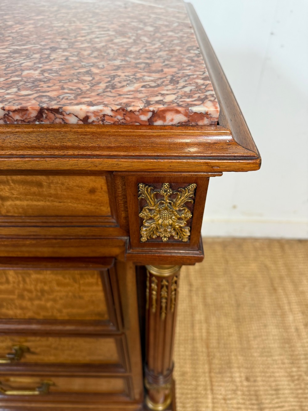 A 19th-century French mahogany commode featuring a red marble top, brass drop handles, and fluted corner columns. View III