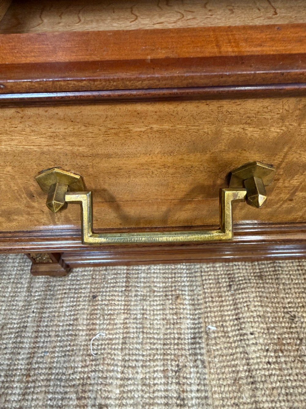 A 19th-century French mahogany commode featuring a red marble top, brass drop handles, and fluted corner columns. View VI