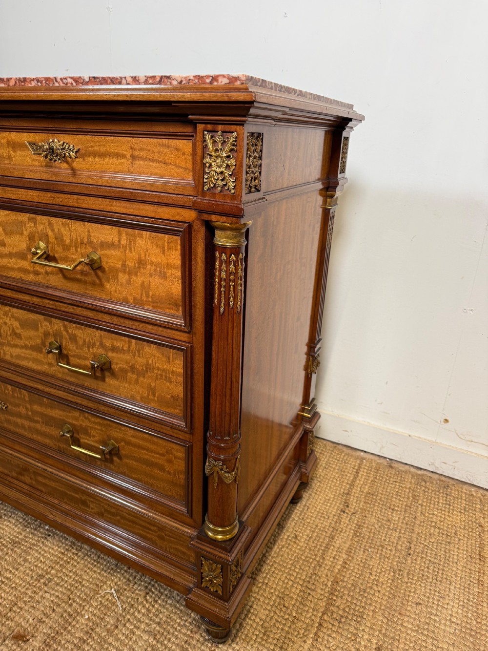 A 19th-century French mahogany commode featuring a red marble top, brass drop handles, and fluted corner columns. View VII