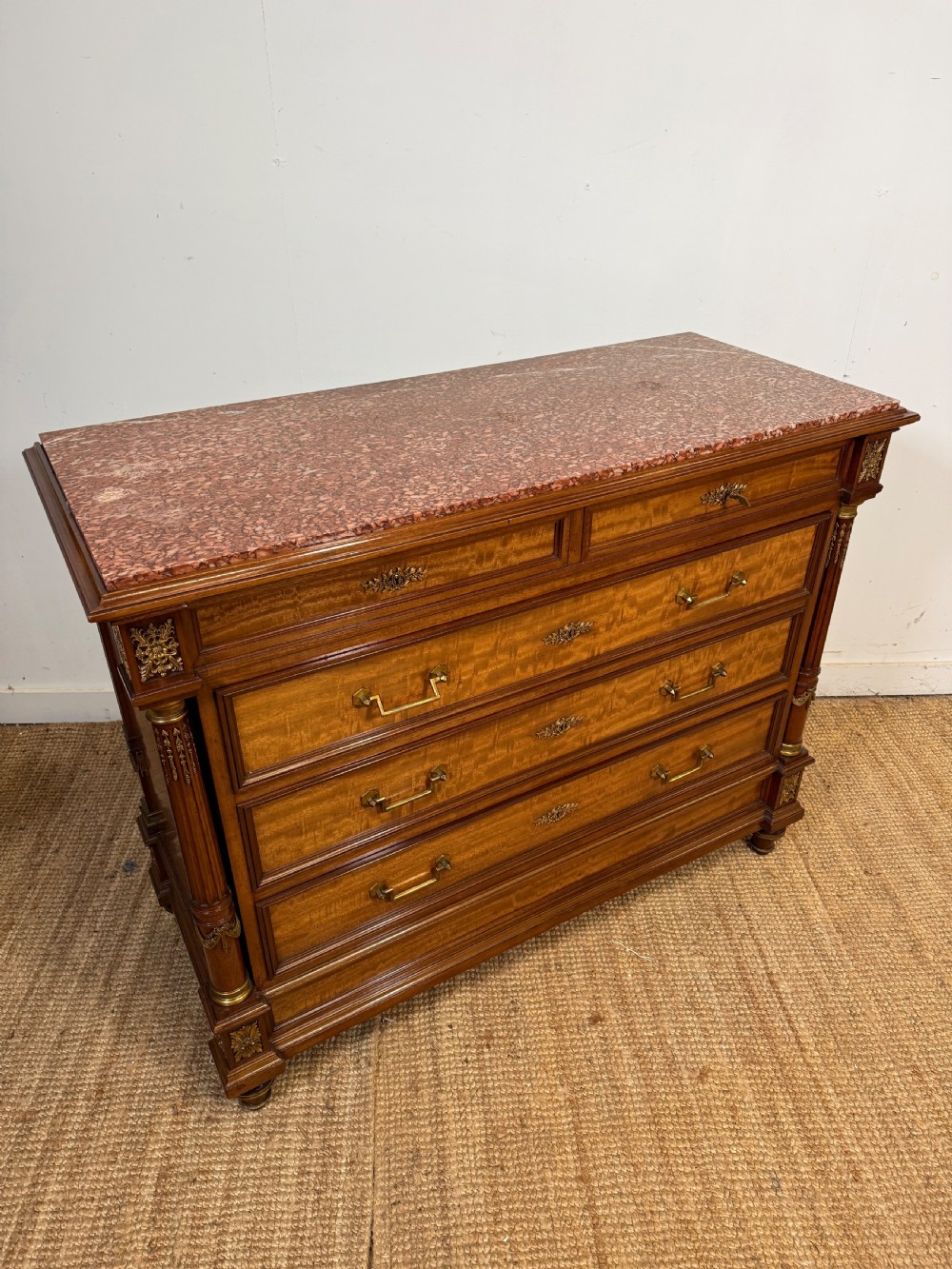A 19th-century French mahogany commode featuring a red marble top, brass drop handles, and fluted corner columns. View XII