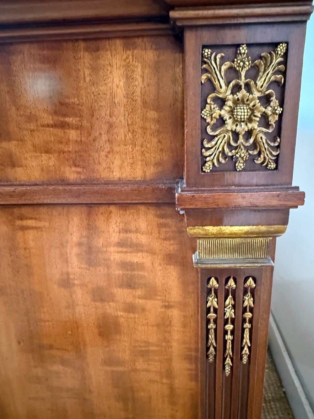 A 19th-century French mahogany commode featuring a red marble top, brass drop handles, and fluted corner columns. View XIV