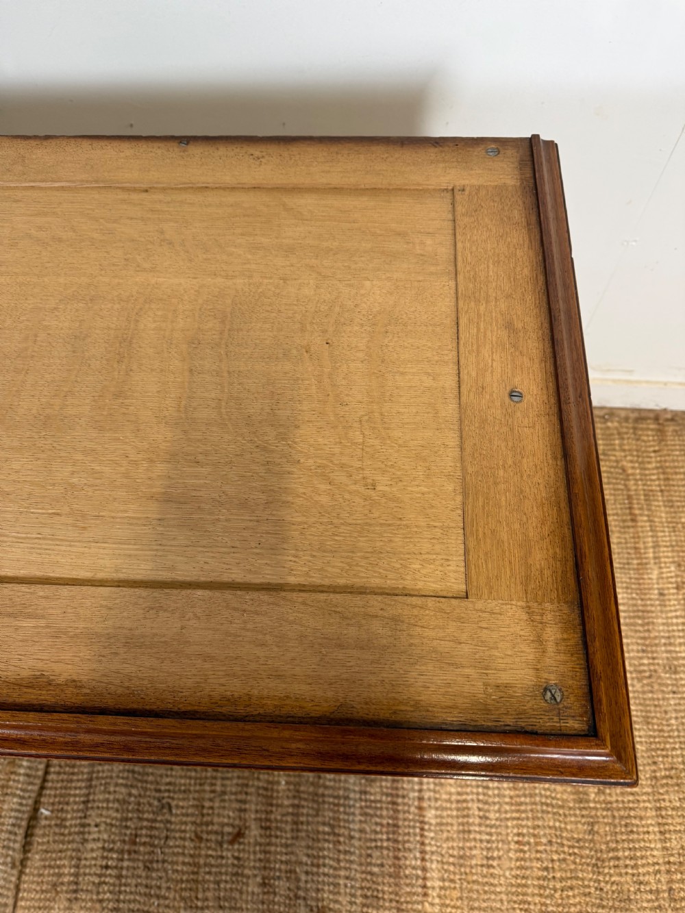 A 19th-century French mahogany commode featuring a red marble top, brass drop handles, and fluted corner columns. View XIX
