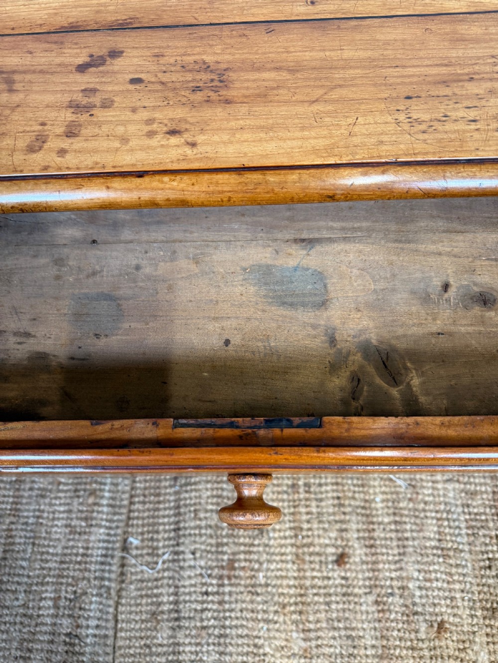 An early nineteenth-century French cherrywood side table featuring cabriole legs, a contoured apron with a single drawer, and a warm honey-coloured timber finish. View X