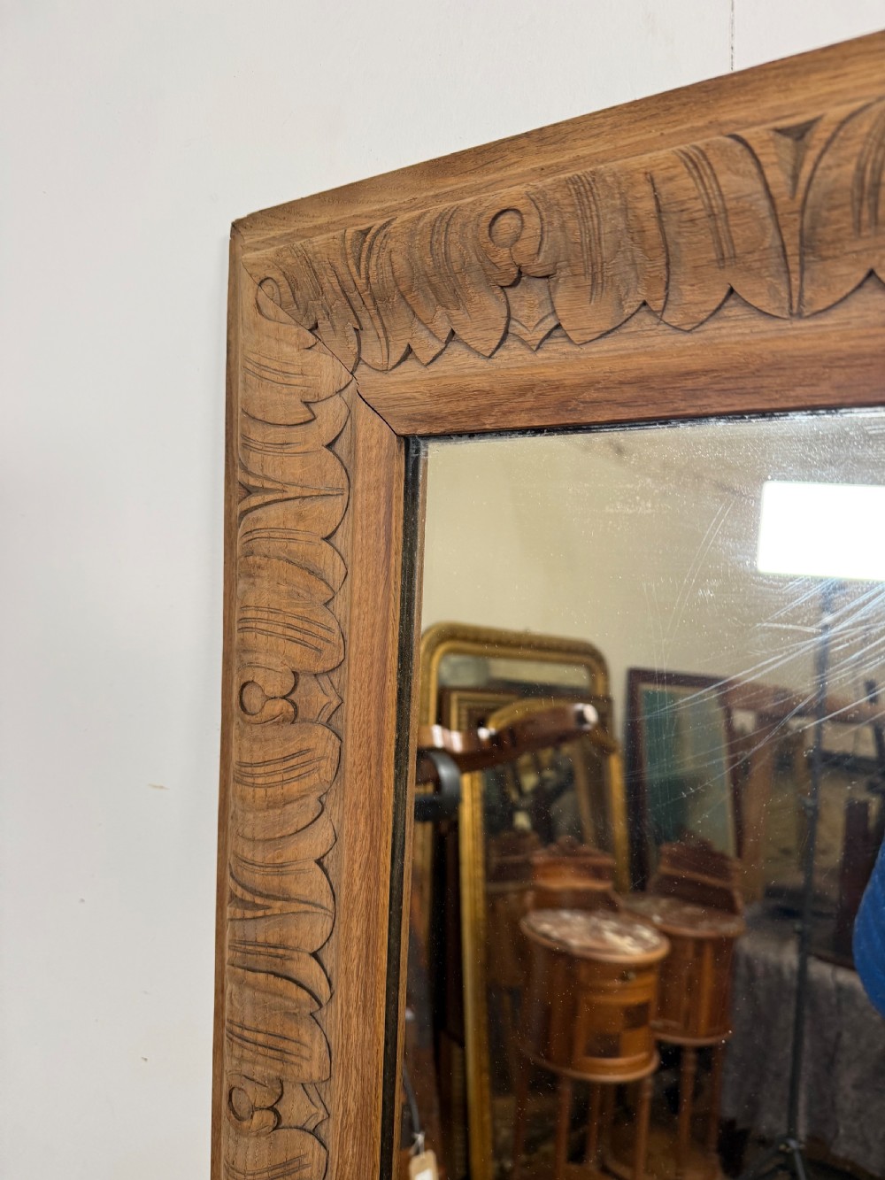 A large rectangular 19th-century wall mirror featuring a wide, hand-carved scrubbed oak frame with foliate border detailing. View IV
