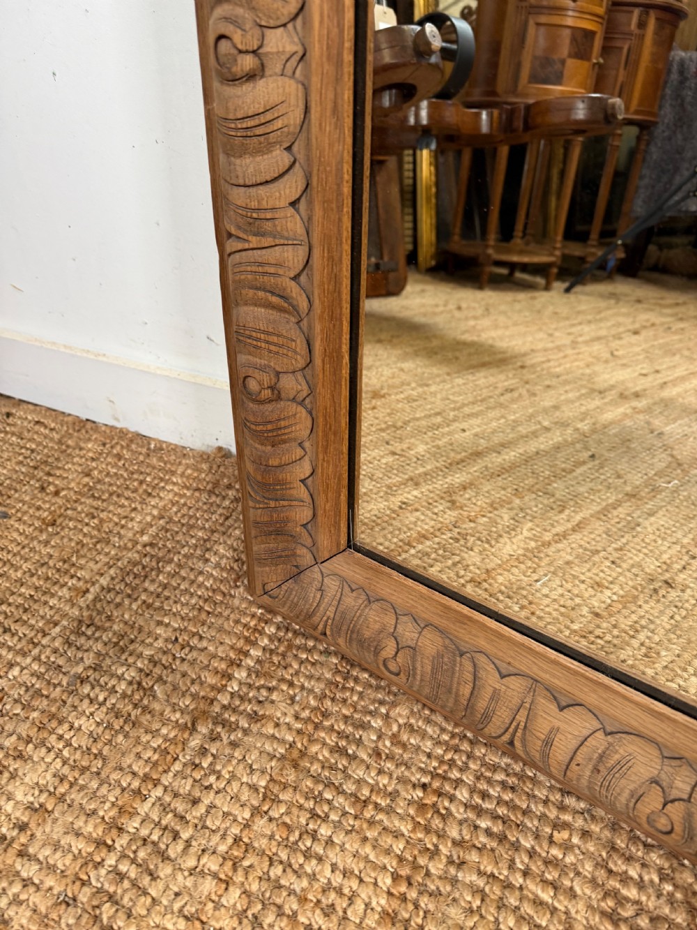 A large rectangular 19th-century wall mirror featuring a wide, hand-carved scrubbed oak frame with foliate border detailing. View VIII