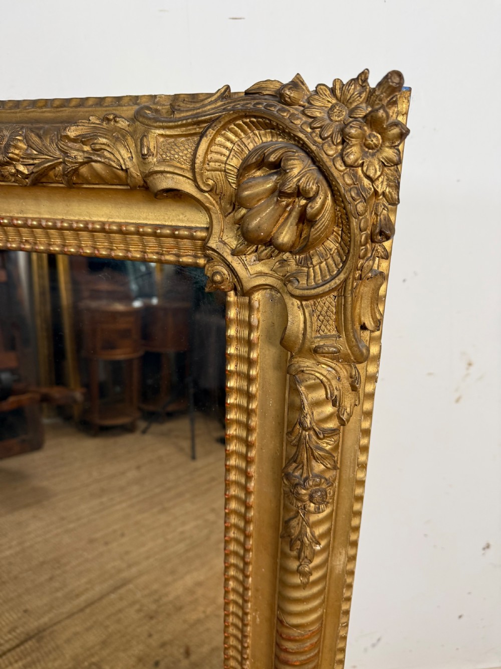 A large rectangular 19th-century French wall mirror featuring a gold leaf gesso frame with rope twist borders and decorative corner flourishes. View III