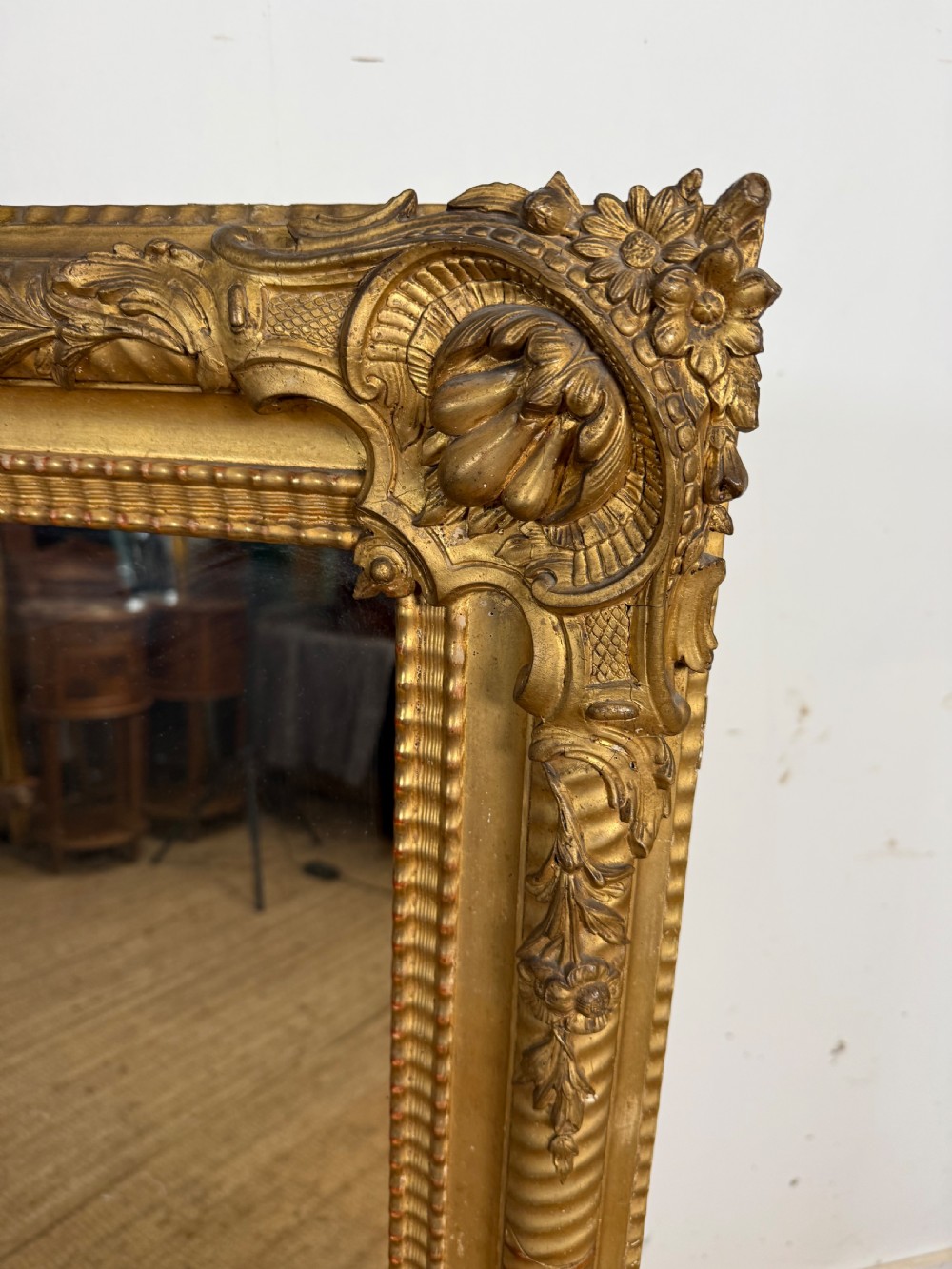 A large rectangular 19th-century French wall mirror featuring a gold leaf gesso frame with rope twist borders and decorative corner flourishes. View IV