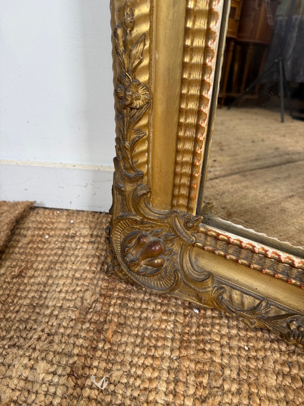 A large rectangular 19th-century French wall mirror featuring a gold leaf gesso frame with rope twist borders and decorative corner flourishes. View V