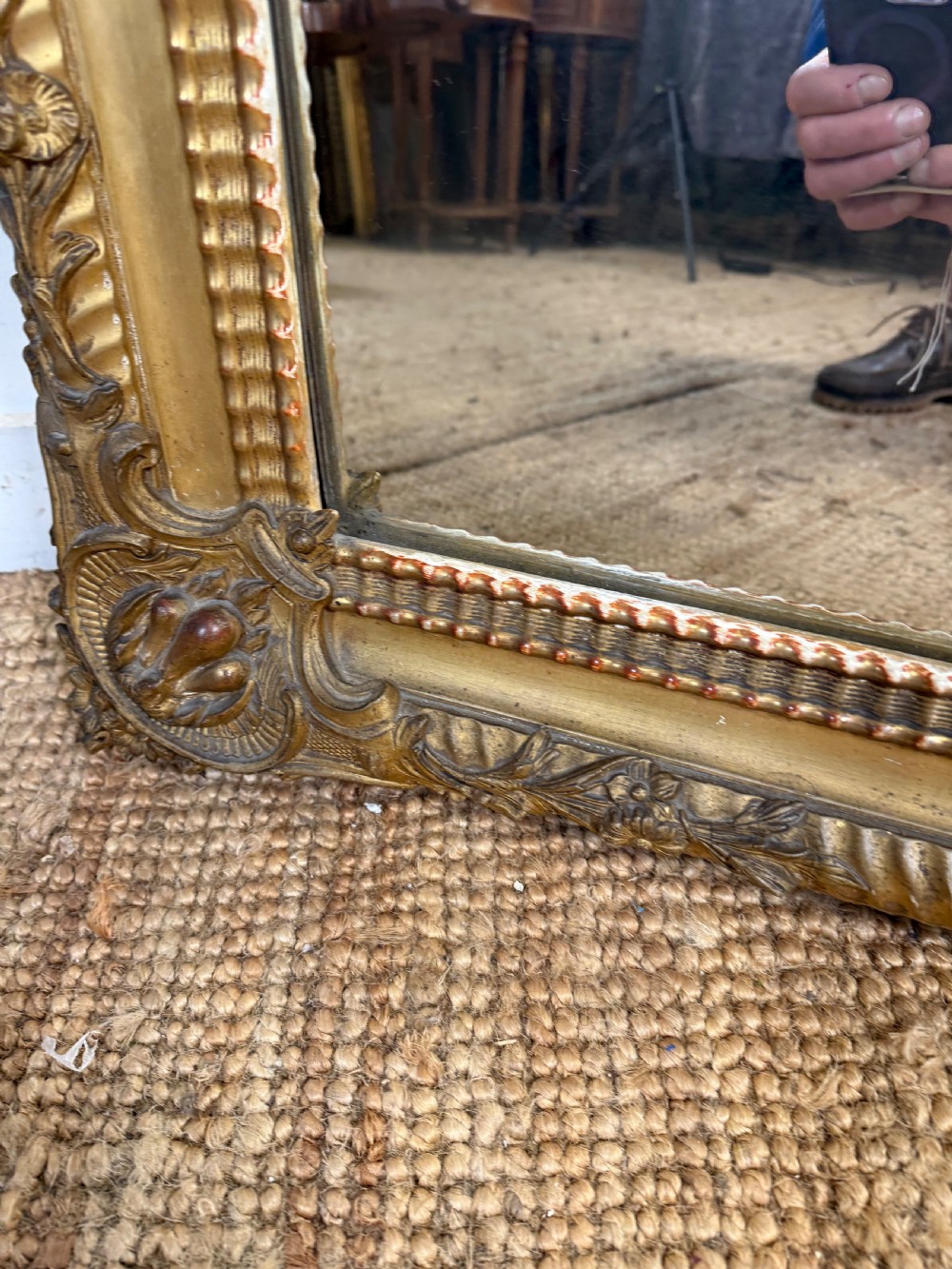 A large rectangular 19th-century French wall mirror featuring a gold leaf gesso frame with rope twist borders and decorative corner flourishes. View IX