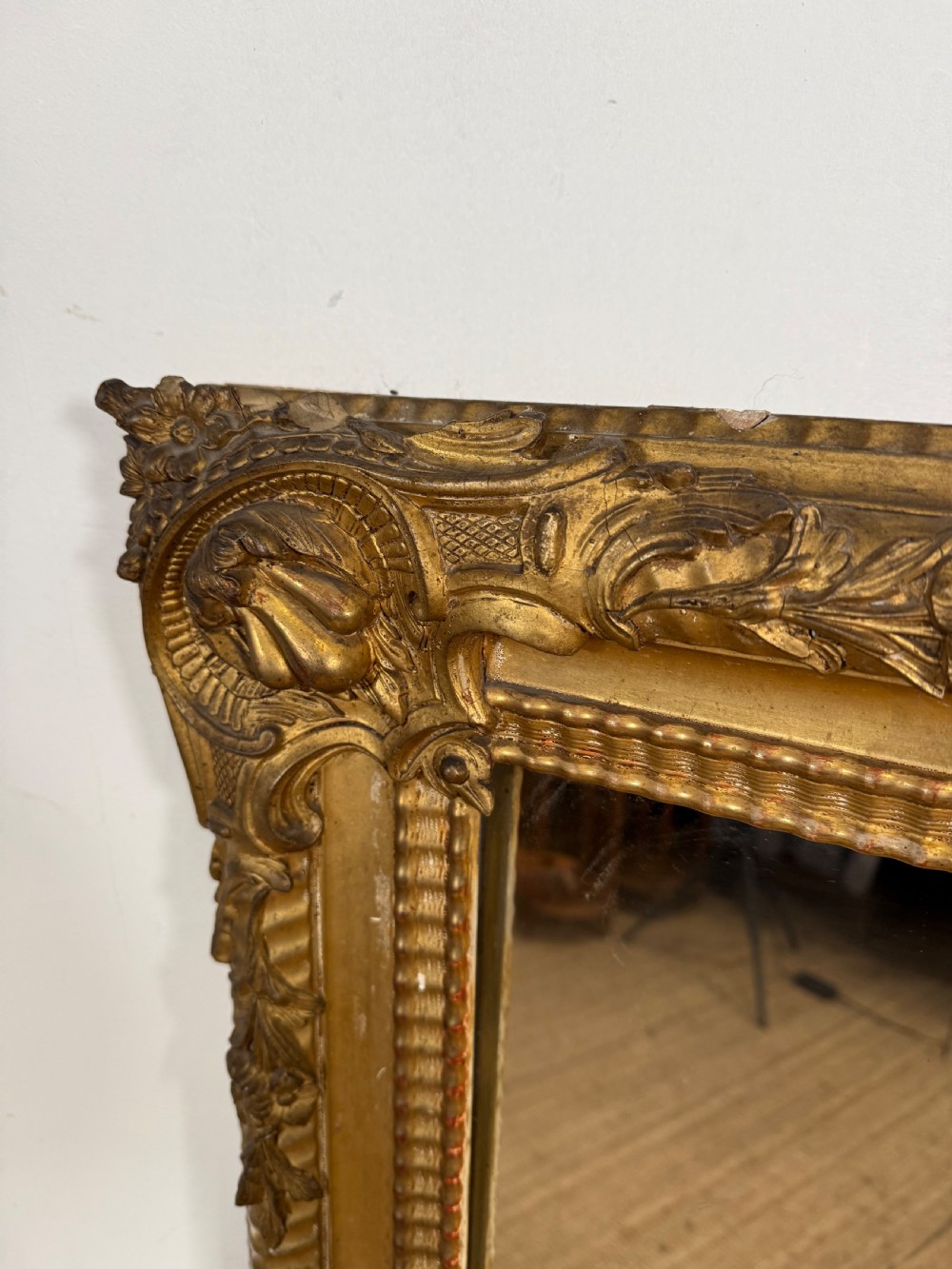 A large rectangular 19th-century French wall mirror featuring a gold leaf gesso frame with rope twist borders and decorative corner flourishes. View XI