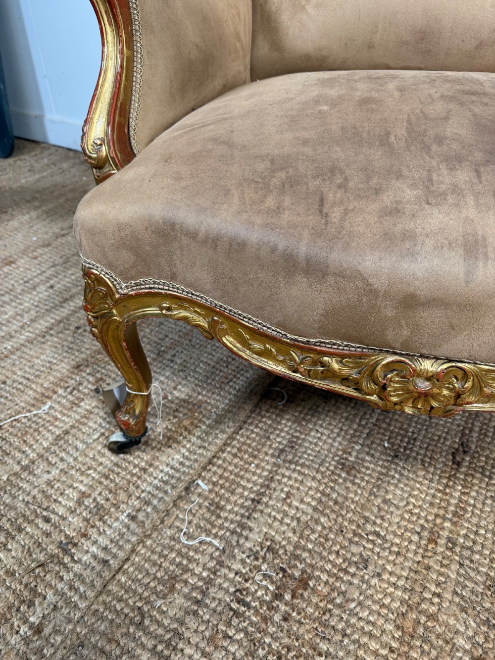 A pair of 19th-century French Napoleon III giltwood armchairs upholstered in taupe velvet with carved floral crests and cabriole legs. View VI