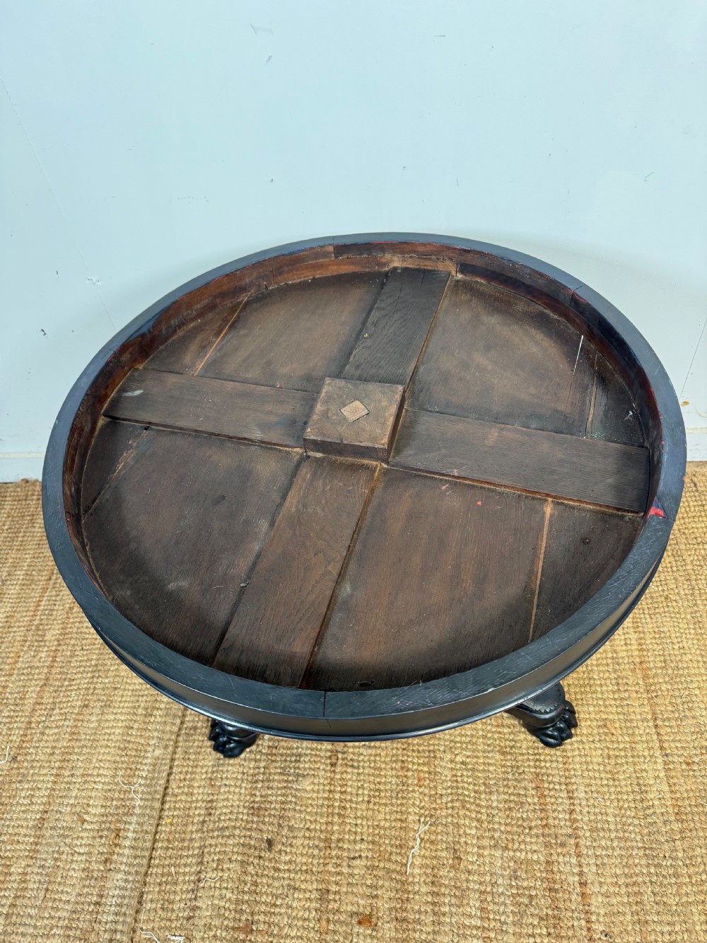 A 19th-century French circular gueridon side table featuring a dark speckled marble top, black painted pedestal support, and scroll feet. View XIII