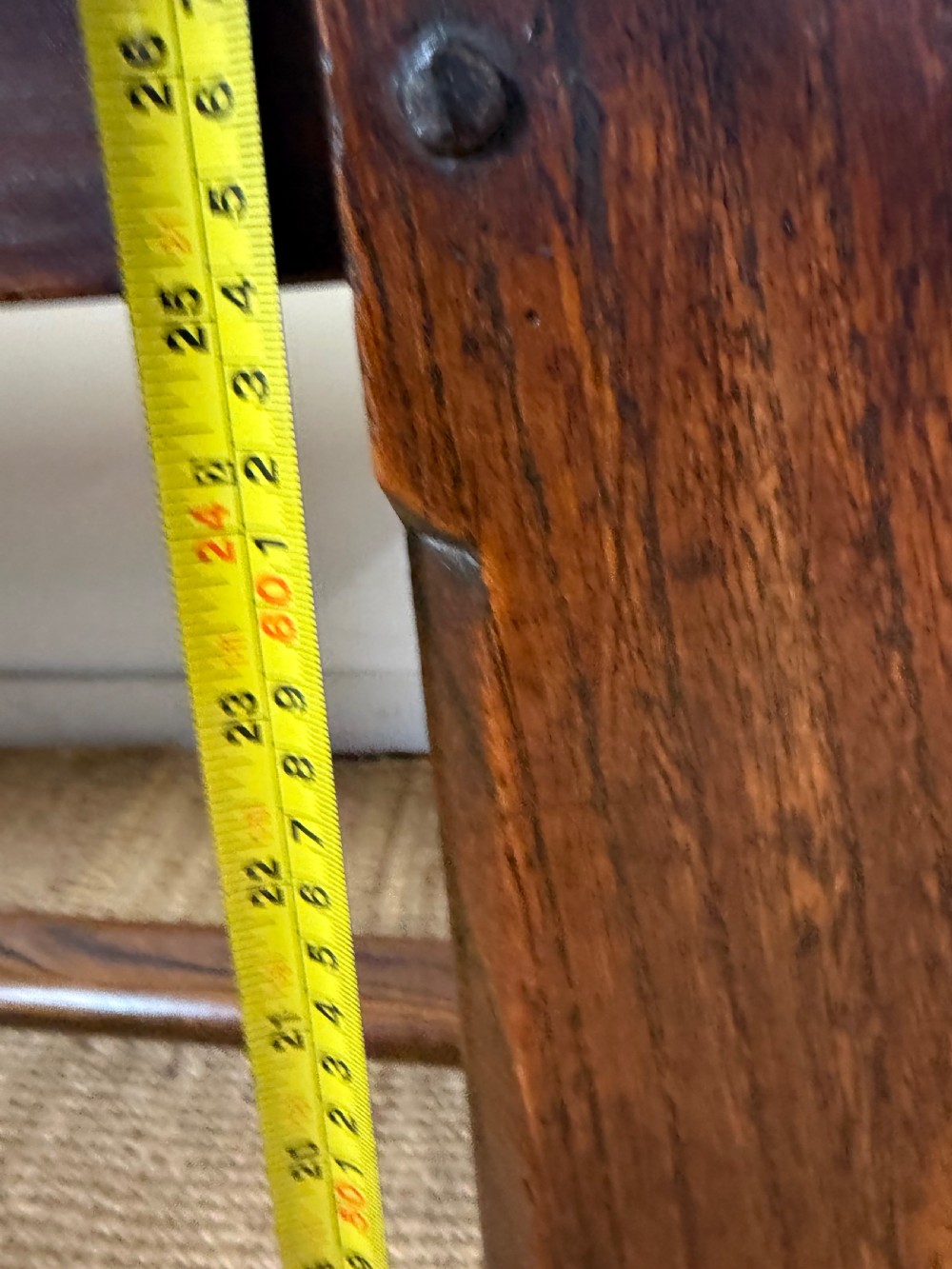 A long 19th-century rustic elm farmhouse dining table featuring a solid plank top and lower support stretchers. View XVIII