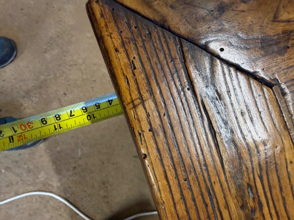 A long 19th-century rustic elm farmhouse dining table featuring a solid plank top and lower support stretchers. View XIX