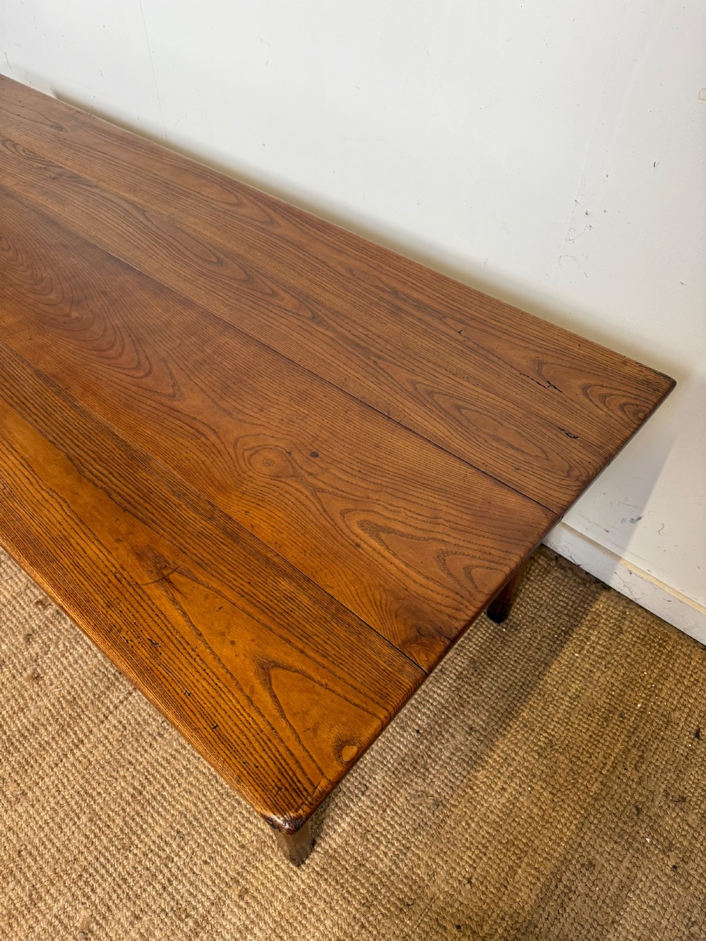 A rectangular late 19th-century chestnut farmhouse table featuring a plank top and four straight tapered legs. View II