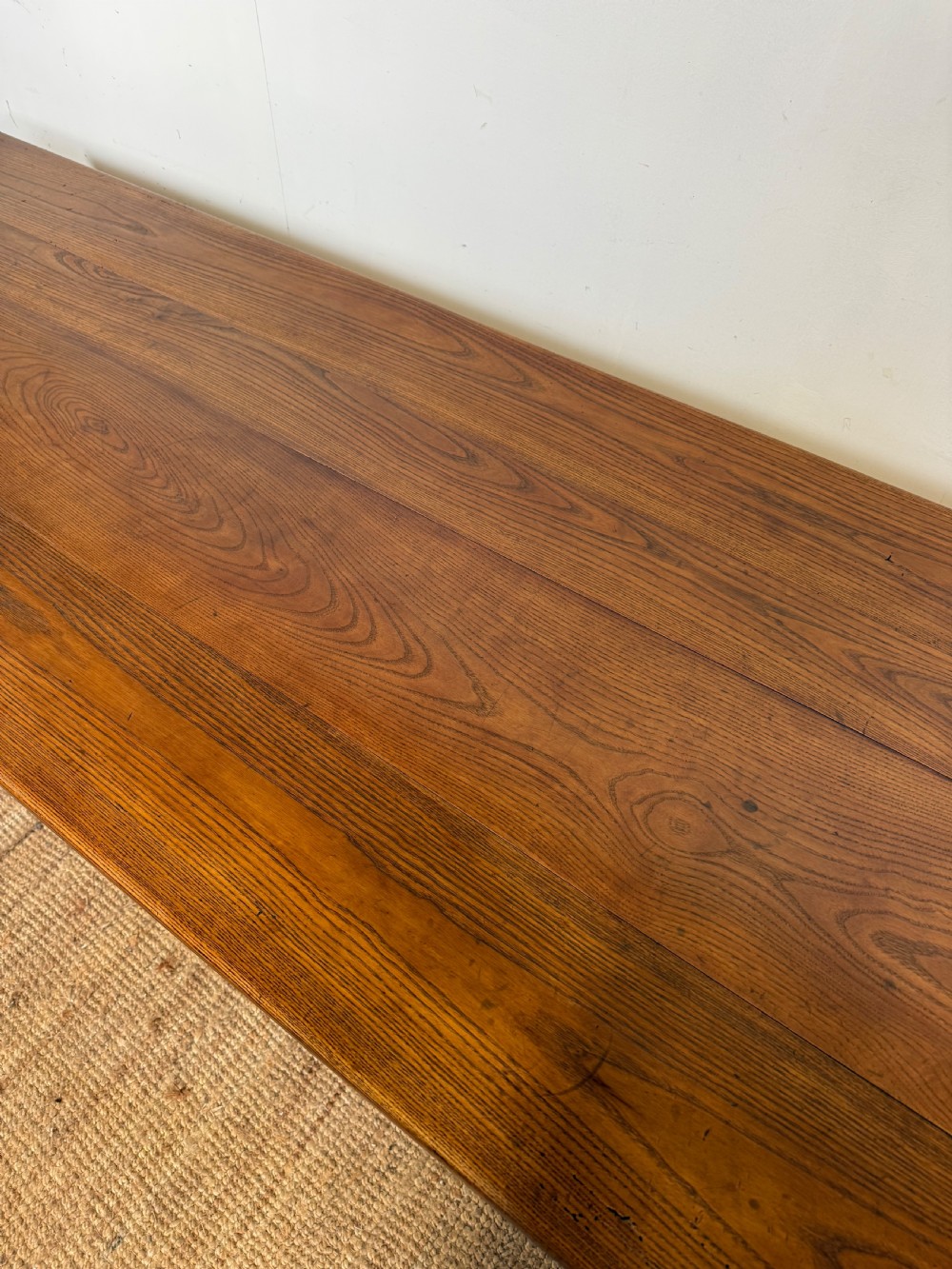 A rectangular late 19th-century chestnut farmhouse table featuring a plank top and four straight tapered legs. View III